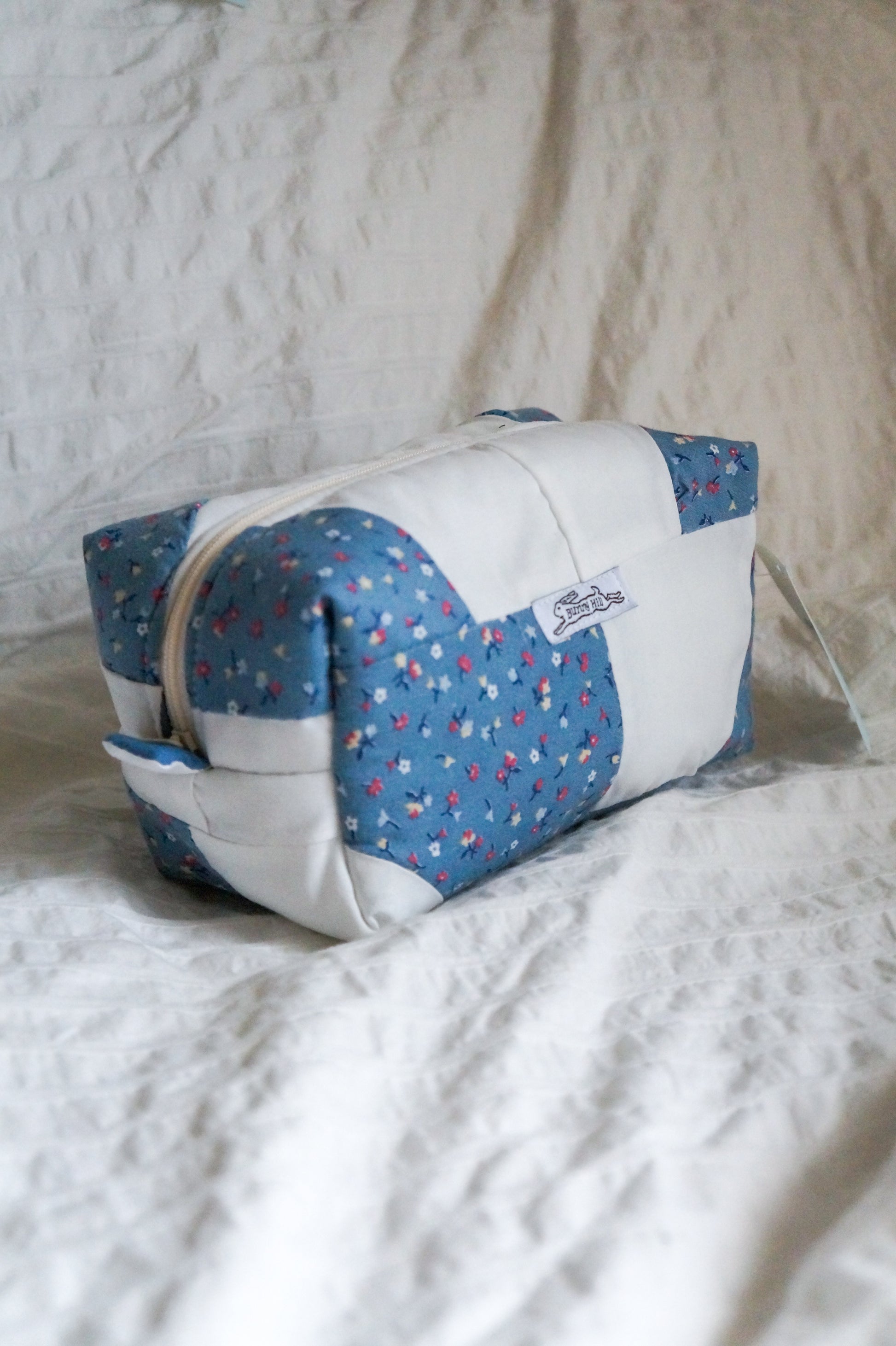 Handmade regular box pouch in blue floral quilt