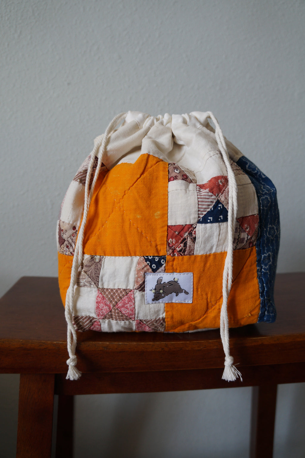 Handmade small 1/1 vintage feedsack quilt drawstring bag