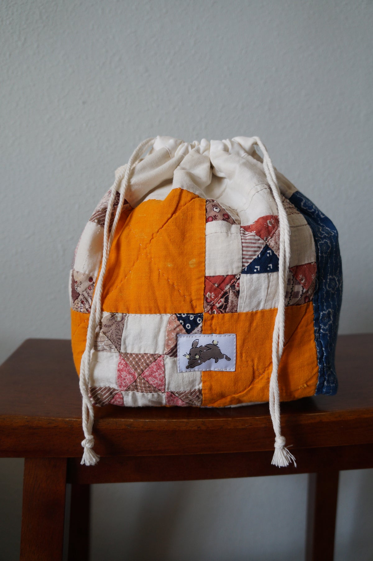 Handmade small 1/1 vintage feedsack quilt drawstring bag